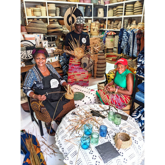 Three people weaving at Design Afrika in Woodstock, South Africa